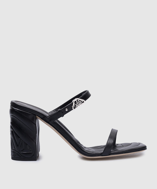 Alexander McQueen Seal black leather mules with metal logo patch