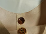 The Love Knot Slouchy Bag: Mini Buckle Edition by Anthropologie - Cream