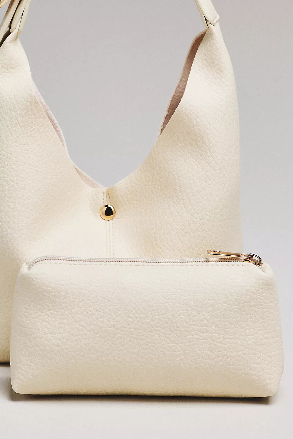 The Love Knot Slouchy Bag: Mini Buckle Edition by Anthropologie - Cream