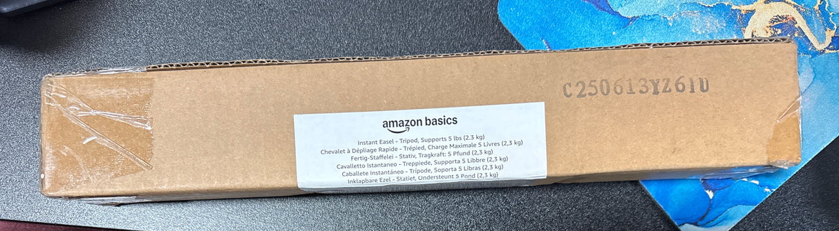 Amazon Basics Easel Display Stand, Instant Floor Postert, Collapsible and Portable with Tripod Base, Black Steel (supports 5 pounds)